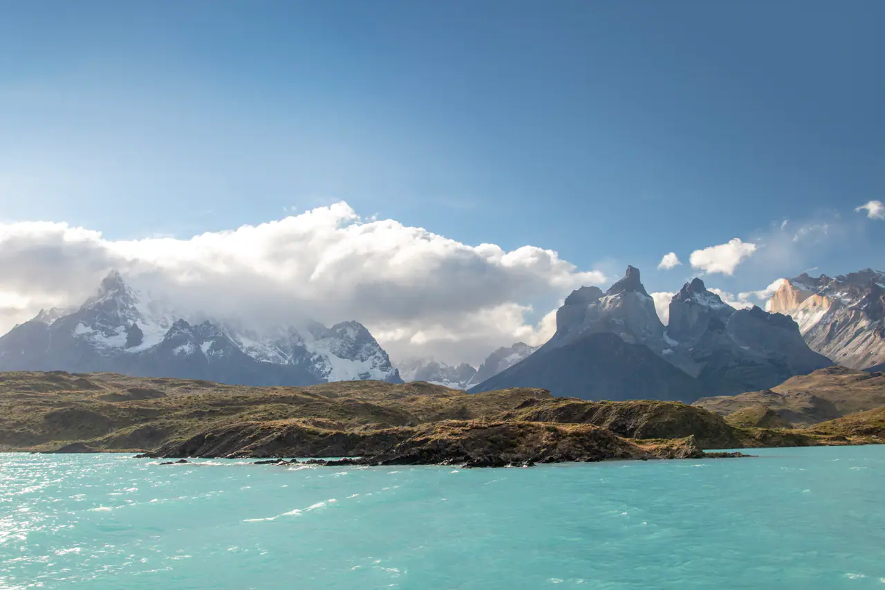 The Cuernos del Paine rising over a turquoise lake in Torres del Paine
