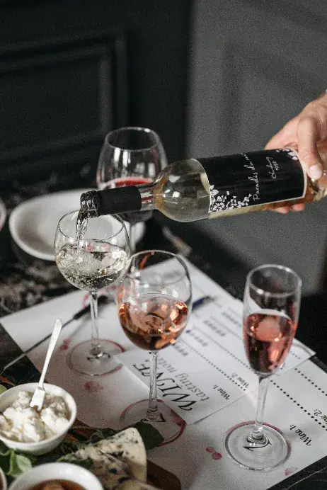 Sparkling wine being poured at a private tasting