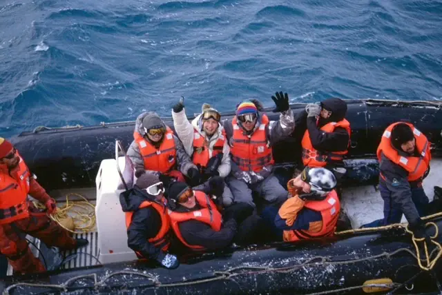 Guests in life jackets aboard a Zodiac in Antarctic waters