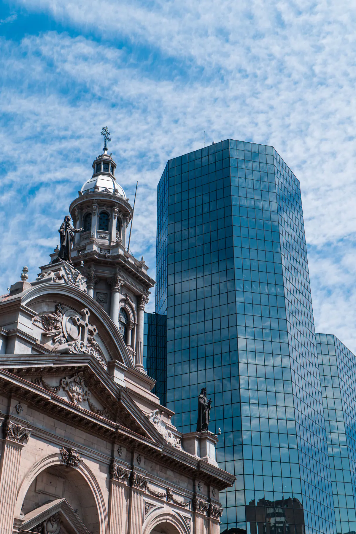 Santiago’s Metropolitan Cathedral beside a modern glass tower